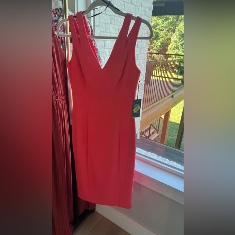 Nwt.  Vince Camuto size 6.  This dress is a beautiful coral color.